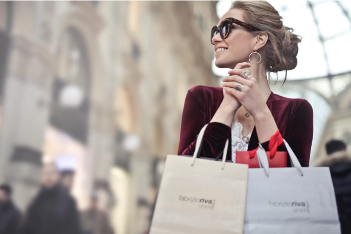a woman holding shopping bags